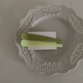Two-piece set of minimalist colorful macaron green hair clips on a white display plate - Green