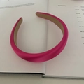 Detail of rose pink padded satin headband with non-slip lining on minimalist magazine - Bright Rose Red