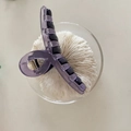 Detail view of purple macaron hair claw clip with black inner teeth and metal spring - Purple Patchwork Cross