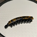 Classic tortoiseshell banana hair clip with amber pattern and black resin comb teeth - Dark Leopard Print
