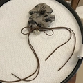 Close-up of vintage floral scrunchie with brown bow and gold heart pendant detail - Tassel Hair Tie / Brown
