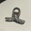 Detail of silver glitter fabric hair claw clip with golden spring mechanism and shiny finish - Small / Silver Gray