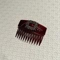 Macro detail of wine red resin hair comb with square rhinestone buckle decoration - Dark Red