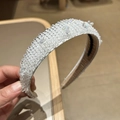Close-up of luxury Baroque headband with white crystal beads and wide fabric base - White