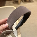 Detailed macro view of dark brown velvet headband with 4cm wide band and non-slip lining - Gray