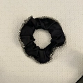 Detail of black satin scrunchie with sparkling crystal beads and elegant silk texture - Black