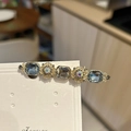 Vintage-Haarspange in Gold mit grau-blauen Steinen im Smaragdschliff und Blumenmuster - Gold