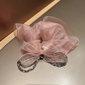 Detail of pink organza hair scrunchie with lace bow and dark grey beaded tassels - Pink