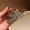 Elegante pinza per capelli con cristalli marroni e molla dorata per acconciature da donna - Grigio
