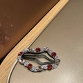 Detail of wavy oval rhinestone hair clip with red and champagne crystals on silver base - Cloud Pink