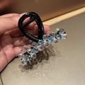 Detail of beaded hair claw clip with blue and clear crystals on black base - Small Light Blue