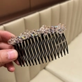 Eleganter Haarkamm mit funkelnden champagnerfarbenen Kristallen auf schwarzer Basis - Rosa