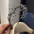 Detailed view of dark grey crystal beads hand-woven on golden wire hair band - Light Gray