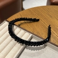 Elegant black beaded headband with sparkling crystals on a jewelry display tray - Black