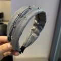 Detailed view of the dark grey fabric headband with sparkling grey rhinestones - Wide Edge Pleated Style / Gray Wide Headband