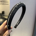 Detail of a black wide headband with grey sparkling rhinestones and handmade label - Thin Beaded Style / Black Thin Headband