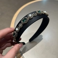 Detail of baroque headband with emerald stones and pearls on black satin wide frame - Green