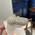 Detailed macro shot of a crystal floral hair clip featuring 3D petals and rhinestones - White (B82-103)