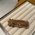 Detail of handmade amber crystal flower hair clip with shiny beaded rectangular base - Champagne (B82-104)