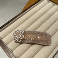 Detailed macro view of pink crystal hairpin with micro pearl flower on beige velvet - Pink (B82-104)