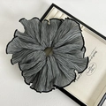 Macro detail of ruffled large hair scrunchie in black and white gingham fabric - Gray Scrunchie