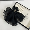 Detailed view of black layered pleated chiffon hair scrunchie with elegant texture - Black Ribbon