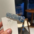 Fermaglio per capelli con cristalli blu, fiore a cinque petali e ciondoli a nappa - Azzurro