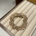 Elegant champagne crystal beaded elastic hair tie displayed in a jewelry box - Pink
