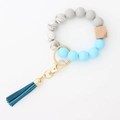 Teal leather tassel keychain with marble silicone beads and hexagonal wood bead - Sky Blue