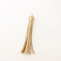 Golden PU leather tassel keychain with metallic clasp for bags and accessories - Gold