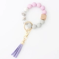 Silicone and wood bead keychain bracelet with pink beads and a purple leather tassel - Light Purple
