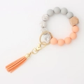 Beaded keychain bracelet with grey and orange silicone beads, wood bead and orange tassel - Peach