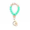 Detail of Christmas silicone bead keychain with mint green beads and festive Santa patterns - Mint Green Christmas Painted Style (2#)