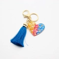 Gradient heart resin keychain with golden rose accents and a dark blue tassel charm - Multi Rose with Blue Tassel