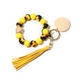 Detail view of silicone bead keychain with sunflower motif, wood bead and yellow tassel - Sunflower