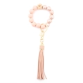 Pink bohemian beaded wristlet keychain with marble texture, wood eye bead and PU fringe - Peach