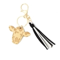 Detail of wooden cow head keychain with black and white tassels and gold hardware - Black and White Tassel Style (1)