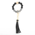 Beaded keychain bracelet with black leopard print beads and long black leather tassel - Spotted Stone