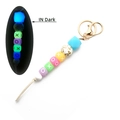 Luminous silicone bead keychain with leopard print and XO letters in dark glow - Blue