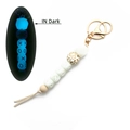 Luminous silicone bead keychain bracelet with leopard print and XO letters in dark blue glow - White