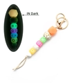 Luminous silicone bead keychain with leopard print and XO letters in dark glow effect - Orange