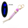 Glow-in-the-dark purple silicone bead keychain with XOXO letters and leather tassel - Purple