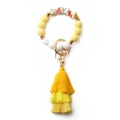 Bohemian yellow and white silicone beaded keychain bracelet with floral bead and tassel - Yellow