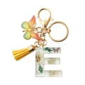 Floral resin letter E keychain with yellow butterfly and tassel in golden finish - Letter E