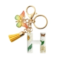 Handmade resin letter H keychain with yellow butterfly charm and daisy floral details - Letter H