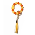 Portachiavi con perline di silicone luminose gialle arancio e nappina in pelle - Arancione