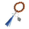 Portachiavi boho con perle di legno marrone, nappa blu e ciondolo a foglia d'argento - Blu