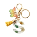 Resin letter S keychain with yellow tassel and dried flowers inside the transparent pendant - S