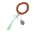 Portachiavi bracciale in legno bohémien con nappa verde menta e ciondolo a foglia - Verde Menta