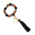 Détail du bracelet porte-clés perlé avec perles en bois, imprimé léopard et pompon noir - Noir